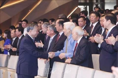Le secrétaire général du Parti, Tô Lâm, et les délégués présents à l’événement, à Hanoi, le 8 août. Photo : VNA
