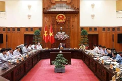 Lors de la réunion du Bureau permanent du Comité du Parti du gouvernement à Hanoi, le 1er juillet. Photo : VNA