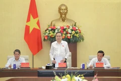 Le président de l’Assemblée nationale, Trân Thanh Mân (centre) s'exprime lors de la conférence, à Hanoi, le 19 octobre. Photo: daibieunhandan.vn