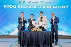 Lors de la cérémonie de signature du partenariat entre FPT et Audax. Photo: vietnamnet.vn