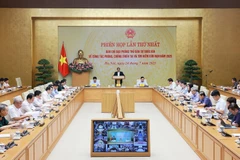 Le Premier ministre Pham Minh Chinh, également président du Comité directeur national de la défense civile, préside la première réunion nationale du comité sur la prévention et le contrôle des catastrophes, ainsi que sur les efforts de recherche et de sauvetage, le 24 juillet. Photo : VNA