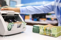 Au 28 juillet, le total des prêts en cours a augmenté de 9,64 % par rapport à la fin de l'année dernière. Photo: VietnamPlus