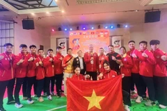 Les combattants vietnamiens posent pour des photos après le Championnat d’Asie du Sud-Est de Pencak Silat 2025, qui s’est terminé en Thaïlande le 14 octobre. Photo : Equipe sportive du Vietnam