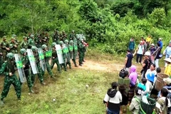 Scène de l’exercice conjoint de protection frontalière entre le Vietnam et le Laos. Photo: VNA