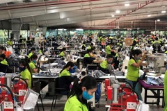 Une entreprise textile à Hung Yên participant à un programme d’amélioration des conditions de travail, de réduction de la consommation d’eau et de réutilisation des matériaux. 