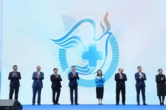 Des délégués ont participé au lancement officiel de l’initiative « L’équité en santé grâce à l’innovation dans les soins de santé », à Hanoi, le 14 décembre. Photo : gracieuseté des organisateurs