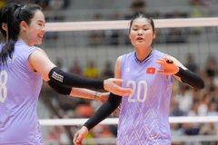 Le Vietnam se qualifie pour les demi-finales de la Coupe des Nations de l'AVC après sa victoire convaincante 3-0 contre l'Inde, à Hanoi, le 11 juin. Photo : VTC