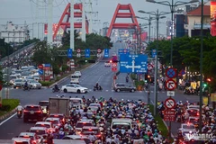Le carrefour des rues Nguyên Van Dông et Nguyên Xi, à Hô Chi Minh aux heures de pointe. VietnamNet