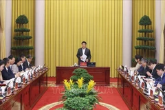 Le président de la République, Luong Cuong, s'exprime à la réunion de travail avec le Bureau présidentiel, le 31 décembre à Hanoï. Photo: VNA