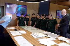 Rencontre entre la délégation du Comité directeur national pour la recherche, le rapatriement et l'identification des restes des soldats morts, et des représentants de l’Australian Army’s Unrecovered War Casualties Unit. Photo: VNA