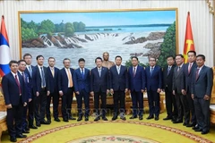 Les deux délégations des ministères vietnamien et lao de la Sécurité publique. Photo: VNA
