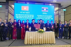 Cérémonie de signature d'un accord de coopération pour la période 2026-2030 entre Thanh Hoa et Houaphan. Photo: VNA