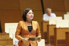 La gouverneure de la Banque d'État, Nguyên Thi Hông, lors de la séance de questions-réponses à la 9e session de la 15e Assemblée nationale, le 19 juin à Hanoï. Photo: VNA