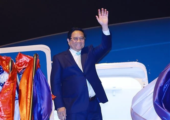 Le Premier ministre Pham Minh Chinh termine sa visite de travail au Laos. Photo : VNA