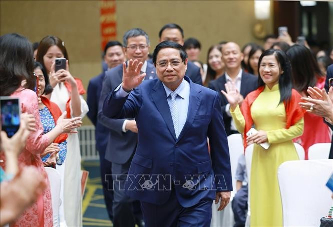 Le Premier ministre Pham Minh Chinh a rencontré des représentants de la communauté vietnamienne en Chine le 31 août. Photo : VNA