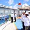 Des délégués effectuent une visite du chantier de PTSC. Photo : VNA