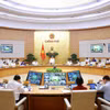 Lors d’une conférence en ligne réunissant le gouvernement et les localités. Photo: VNA