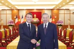 Le secrétaire général du Parti, Tô Lâm, et le président français, Emmanuel Macron. Photo: VNA
