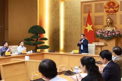 Le Premier ministre préside la conférence sur le développement de la plateforme d'échange de données. Photo: VNA