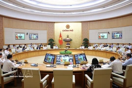 Panorama de la réunion ordinaire du gouvernement pour mars. Photo: VNA