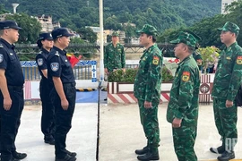 Le commandement de patrouille conjointe à la ligne de démarcation du poste frontalier international de Lào Cai. Photo : qdnd.vn 