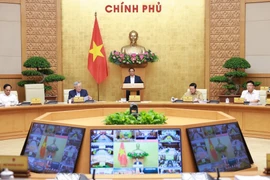Le Premier minsitre Pham Minh Chinh préside la réunion gouvernementale mensuelle de juin 2025 ainsi qu'une visioconférence nationale entre le gouvernement et les localités. Photo: VNA