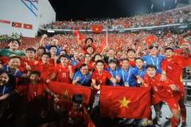 Les joueurs du Vietnam U22 exultent après leur victoire. Photo: VNA