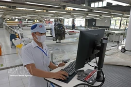 Le textile-habillement à l’export, l’un des secteurs contribuant à la croissance. Photo: VNA