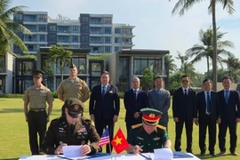 Cérémonie de signature du procès-verbal du rapatriement des restes de soldats américains portés disparus pendant la guerre au Vietnam. Photo : ministère des AE