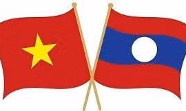 Coopération Vietnam-Laos dans l’organisation d’une foire de mise en relation commerciale