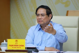 Le Premier ministre Pham Minh Chinh lors de la réunon. Photo : VNA