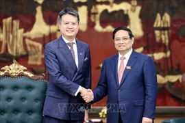 Le Premier ministre Pham Minh Chinh (droite) et le Directeur général de l’Organisation mondiale de la propriété intellectuelle (OMPI), Daren Tang. Photo : VNA