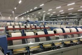 Une usine textile de Bảo Lân produisant des fibres, du fil et du tissu cotonnés à partir de feuilles d'ananas. Photo courtoisie de l'entreprise