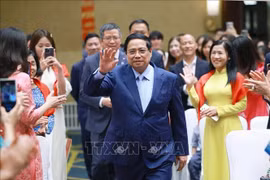 Le Premier ministre Pham Minh Chinh a rencontré des représentants de la communauté vietnamienne en Chine le 31 août. Photo : VNA