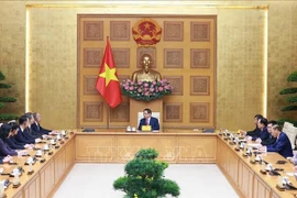 Le Premier ministre Pham Minh Chinh a reçu, le 25 septembre, à Hanoi, Lin Wu, membre du Comité central du Parti communiste chinois, secrétaire du Comité du Parti de la province du Shandong et président du Comité permanent de l’Assemblée populaire provinciale du Shandong, en visite de travail au Vietnam. Photo : VNA