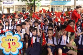 Des élèves du primaire lors de la cérémonie d'ouverture de la nouvelle année scolaire le 5 septembre (Photo : VNA)