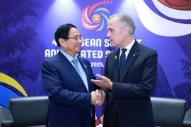 e Premier ministre Pham Minh Chinh et son homologue canadien Mark Carney. Photo : VNA