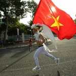 Un athlète court le marathon international Vietcombank du delta du Mékong 2025. Photo : VNA