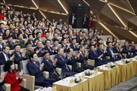 le secrétaire général du Parti, To Lam, et les délégués lors de l'événement. Photo: VNA