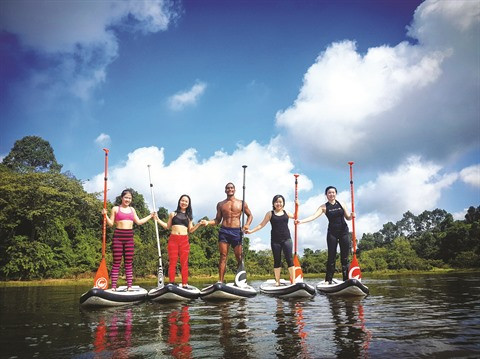 Le stand up paddle sur le fleuve Sài Gon: bonheur garanti! ảnh 1 Le stand up paddle sur le fleuve Sài Gon: bonheur garanti! ảnh 1