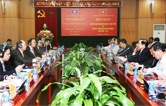 Vietnam et Laos partagent leurs expériences en matière de gestion des administrations locales ảnh 1 Vietnam et Laos partagent leurs expériences en matière de gestion des administrations locales ảnh 1