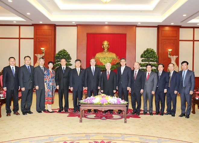 Le leader du PCV reçoit une haute délégation du PCC ảnh 2