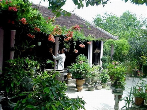 Propos sur la maison traditionnelle des Viêt ảnh 2