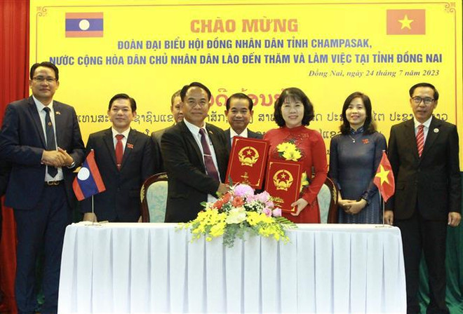 Dong Nai et Champasak échangent des expériences dans les activités du Conseil populaire ảnh 2