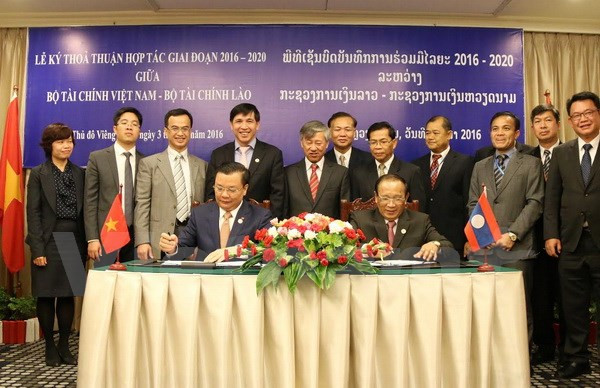 Vietnam et Laos resserrent leur cooperation dans la finance ảnh 1 Vietnam et Laos resserrent leur cooperation dans la finance ảnh 1