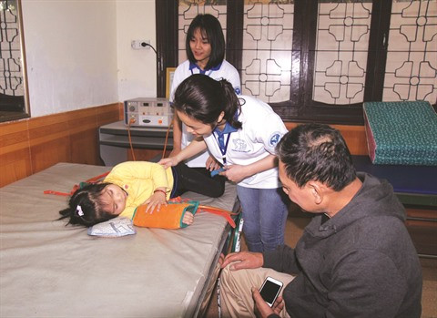 Des jeunes volontaires en blouse blanche à Vinh ảnh 1 Des jeunes volontaires en blouse blanche à Vinh ảnh 1