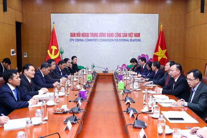 Le Vietnam et le Laos partagent des expériences dans la mobilisation des masses ảnh 1 Le Vietnam et le Laos partagent des expériences dans la mobilisation des masses ảnh 1