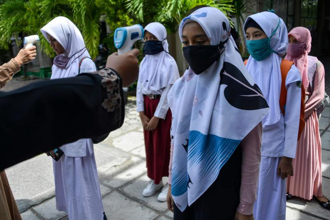 COVID-19 : des pays d'Asie du Sud-Est confirment des milliers de nouveaux cas ảnh 1