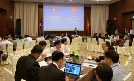 Colloque Vietnam - Laos sur la coopération dans le travail et le bien-être social ảnh 1 Colloque Vietnam - Laos sur la coopération dans le travail et le bien-être social ảnh 1