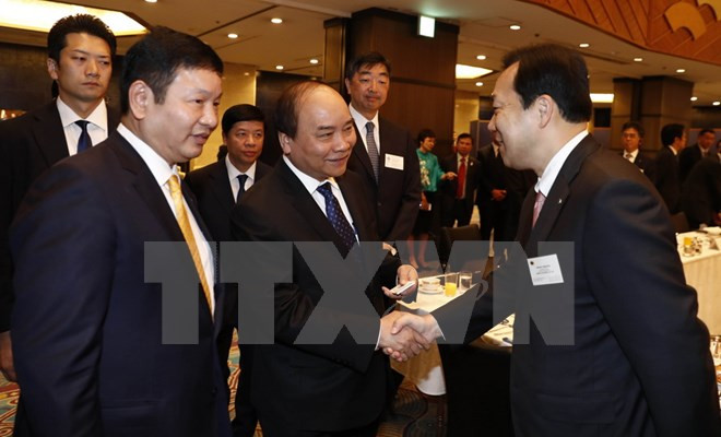 Le PM Nguyen Xuan Phuc au colloque avec les entreprises des TI du Japon ảnh 1 Le PM Nguyen Xuan Phuc au colloque avec les entreprises des TI du Japon ảnh 1